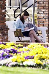 Student studying on a bench.